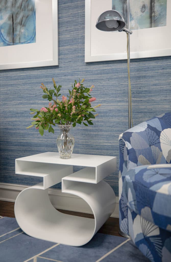 Unique side table with blue chair